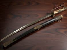 A reproduction Japanese Second World War II naval officer's sword, in scabbard.