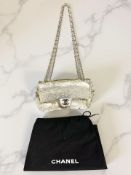 A Chanel sequin hand bag, serial number 15914546, with black dust cover bag.