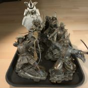 A group of reproduction samurai ornaments.