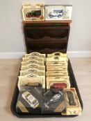 A group of Lledo boxed die cast vehicles, a further die cast F1 car, two wooden display stands, etc.