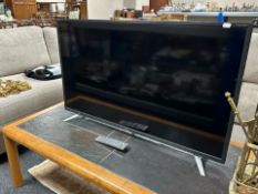 A Sharp Aquos 40 inch LCD TV with lead and remote