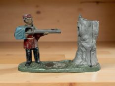 A reproduction novelty cast metal money box, height 16 cm.