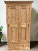 A modern pine double door wardrobe, 103 cm x 56 cm x 195 cm.
