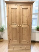 A modern pine double door wardrobe, 103 cm x 56 cm x 195 cm.