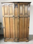 A Marcus Limited panelled oak double door wardrobe, 124 cm x 55 cm x 186 cm.