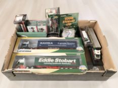 A group of Corgi, Oxford and other Eddie Stobart collectibles including die cast haulage vehicles,