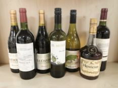 Seven bottles of alcohol including Hennessey Very Special cognac, Bordeaux, La Chasse, etc.