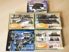 Four various modern railway sets.