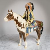 A Beswick figure : Mounted Indian, model 1391, skewbald, height 21 cm.