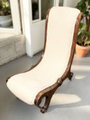 A Victorian mahogany lady's chair in cream upholstery
