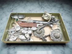 A group of metal wares including two decorative knives, antique key, assorted tourist spoons,