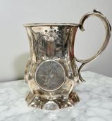 A Victorian silver mug, Hilliard & Thomason, Birmingham 1855, height 12cm.