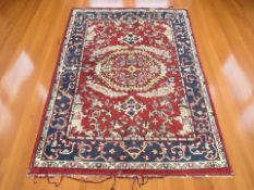 A woollen Eastern-design rug ,