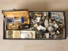 A collection of thimbles including some silver examples.