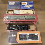 A group of boxed OO and HO gauge rolling stock including Hornby and Lima.