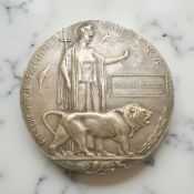 A World War I bronze death penny, named to William Dodds.