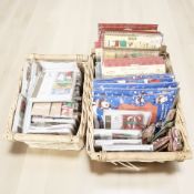 A large quantity of Christmas greetings cards and craft items, contained in two wicker baskets.