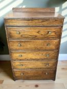 An Edwardian oak five drawer chest,