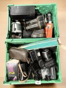 A group of vintage and later cameras including Olympus, a pair of lacquered brass field glasses,