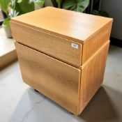 A teak effect MDF single drawer chest and a matching fall front cabinet,