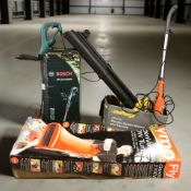 A Bosch electric garden strimmer, Challenge leaf blower/vacuum,
