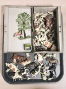 A collection of die cast hand painted metal farm animals and similar figures.