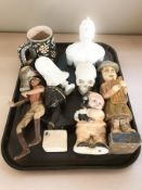 A group of figurines, skull ornament, glazed terracotta mug, busts, etc.