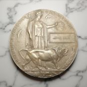 A World War I bronze death penny, named to John Kelly.