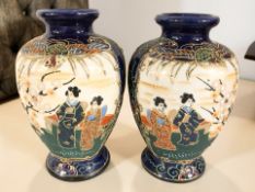 A pair of 20th century Japanese export satsuma earthenware vases, height 19 cm.
