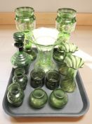 A group of Victorian and later green glass wares including two pairs of vases, a uranium glass vase,
