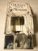 A pine Colman's Mustard box containing a collection of glass photographic negatives.