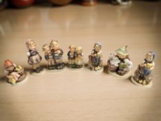 Seven West German Goebel figures of boys and girls