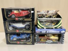 A group of Bburago and other die cast cars in boxes