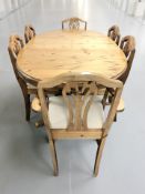 A reproduction pine oval extending dining table, overall 200 cm x 105 cm x 76 cm,