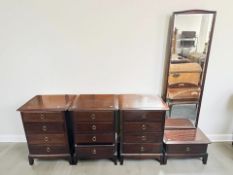 Three Stag Minstrel four drawer bedside chests, each 52 cm wide,