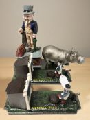 A reproduction painted cast iron Uncle Sam money box,