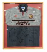 A framed and signed Manchester United football shirt, size XL, 1995-96 away shirt,