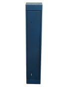 A metal gun cabinet with keys,