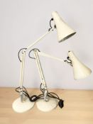 Two enameled angle poised lamps.
