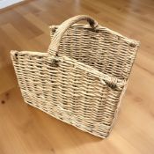 A wicker log carrying basket, width 58 cm.