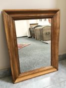 An early 20th century continental walnut mirror, 83 cm x 63 cm.