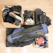 A group of gold bags, golf club head covers,