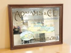 A reproduction Adnams & Co. Ltd picture mirror, overall 54 cm x 69 cm.