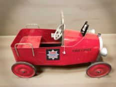 A child's tin ride-on fire chief car, length 102 cm.