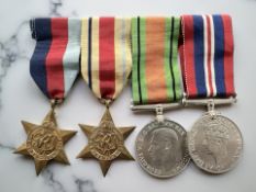 A bar of WWII service medals comprising 1939 /1945 Star, Africa Star,