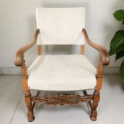 A continental heavily carved oak armchair
