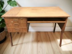 A 20th century Danish teak single pedestal writing desk, 112 cm x 60 cm x 73 cm.