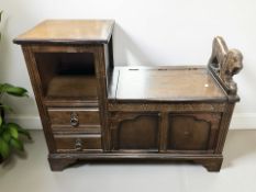 A reproduction oak telephone seat, width 92 cm.
