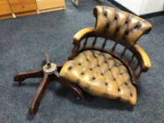 A Chesterfield style Oxblood tan leather captain's swivel armchair (as found)