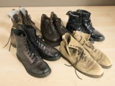 Three pairs of Dr Martens lace-up boots, and two further pairs of shoes.
